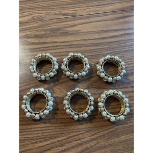 Set of six gold tone napkin rings with gold cream beads